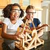 Two young girls with safety glasses